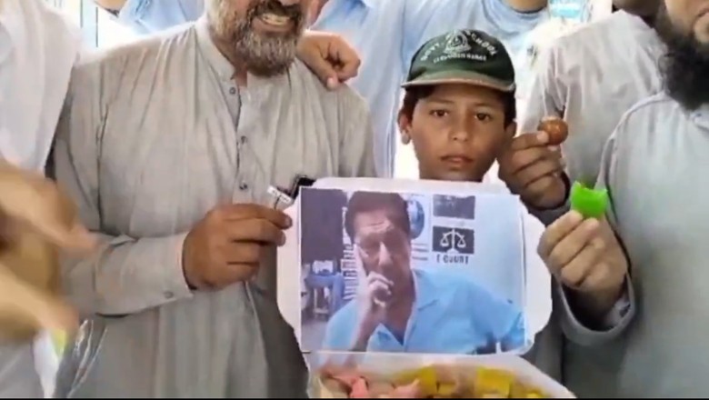 Watch: KP people distribute sweets after seeing Imran Khan in leaked picture