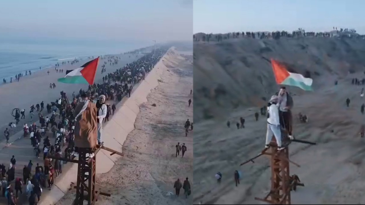 WATCH: Two young men hoist Palestinian on a tower