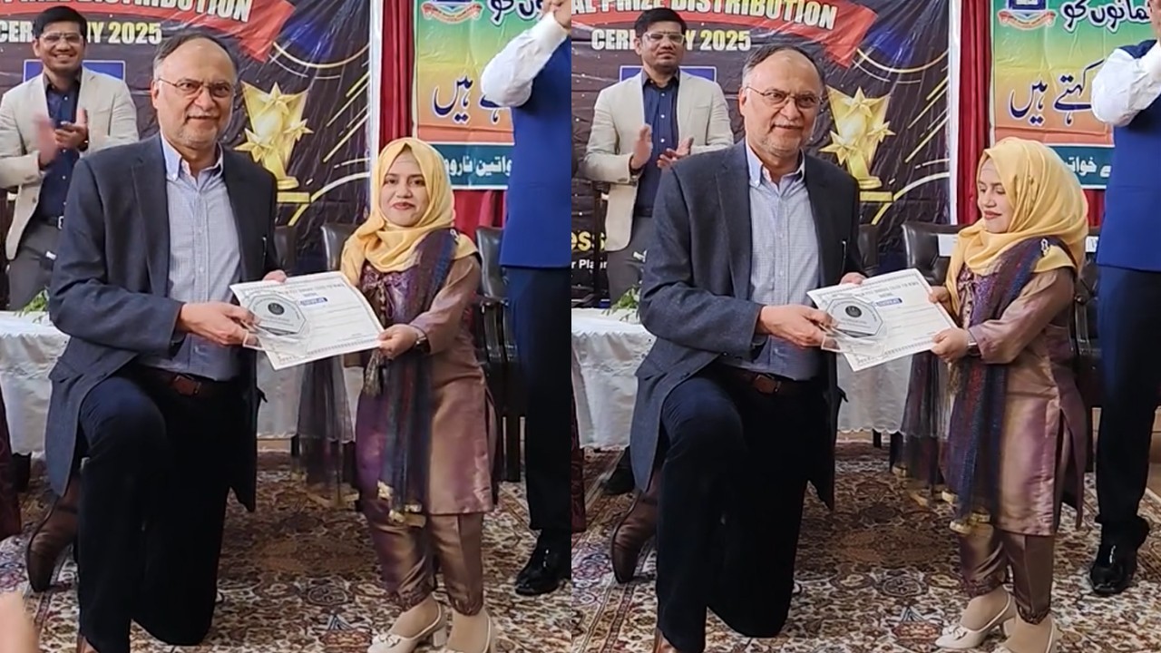 Ahsan Iqbal kneels down to present award to teacher in Narowal