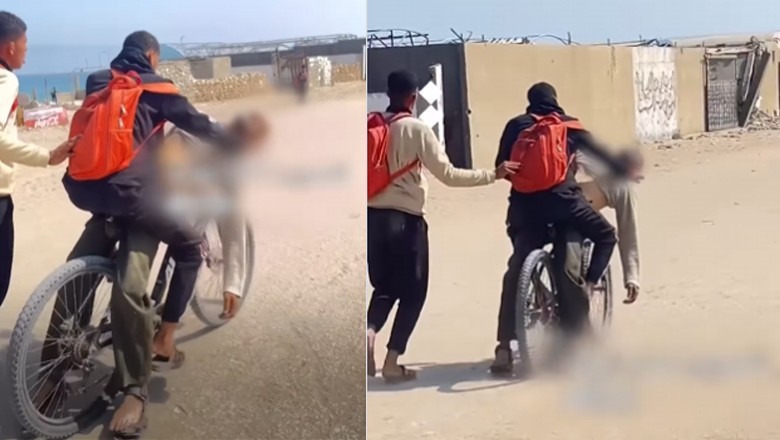 Watch: Heart-wrenching video shows man transporting slain father on bicycle in Gaza