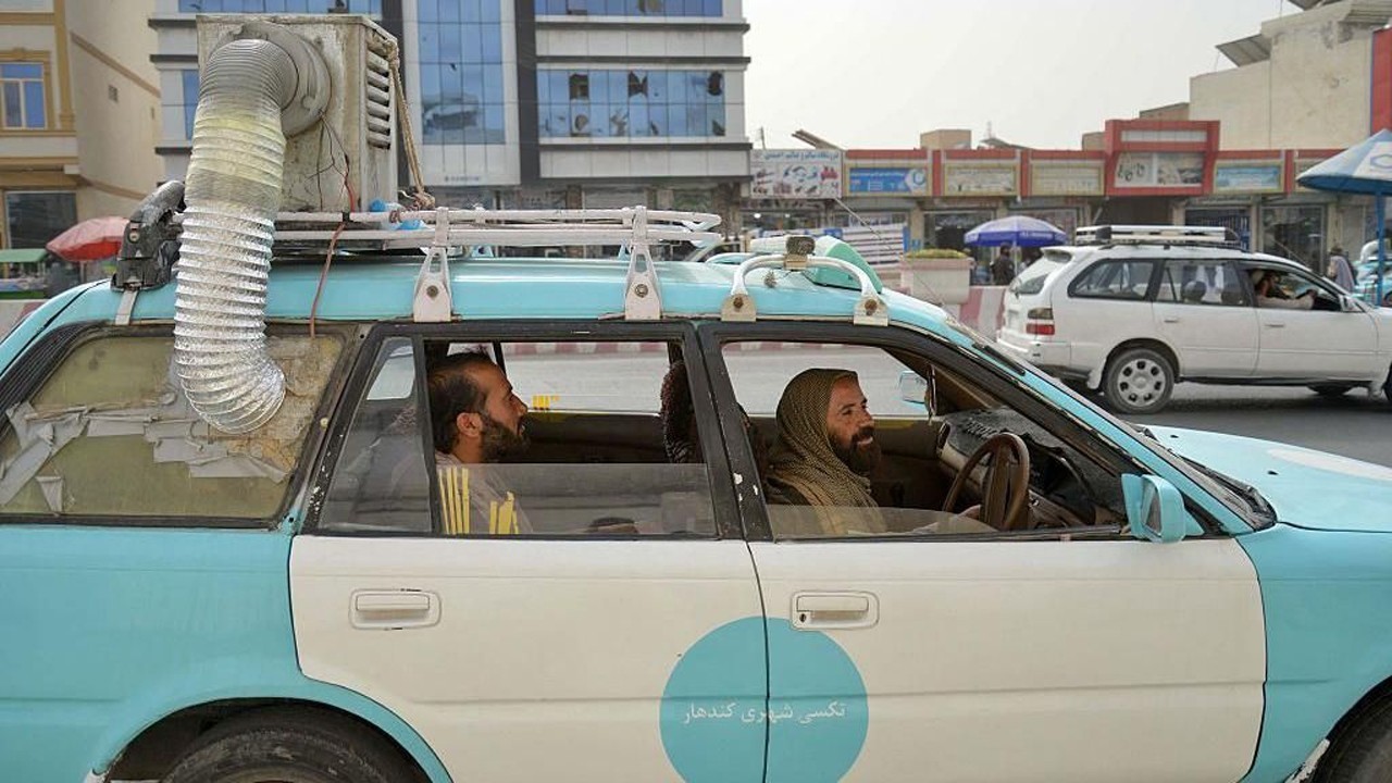 Afghan taxi drivers build low-cost coolers for cabs to survive the heat