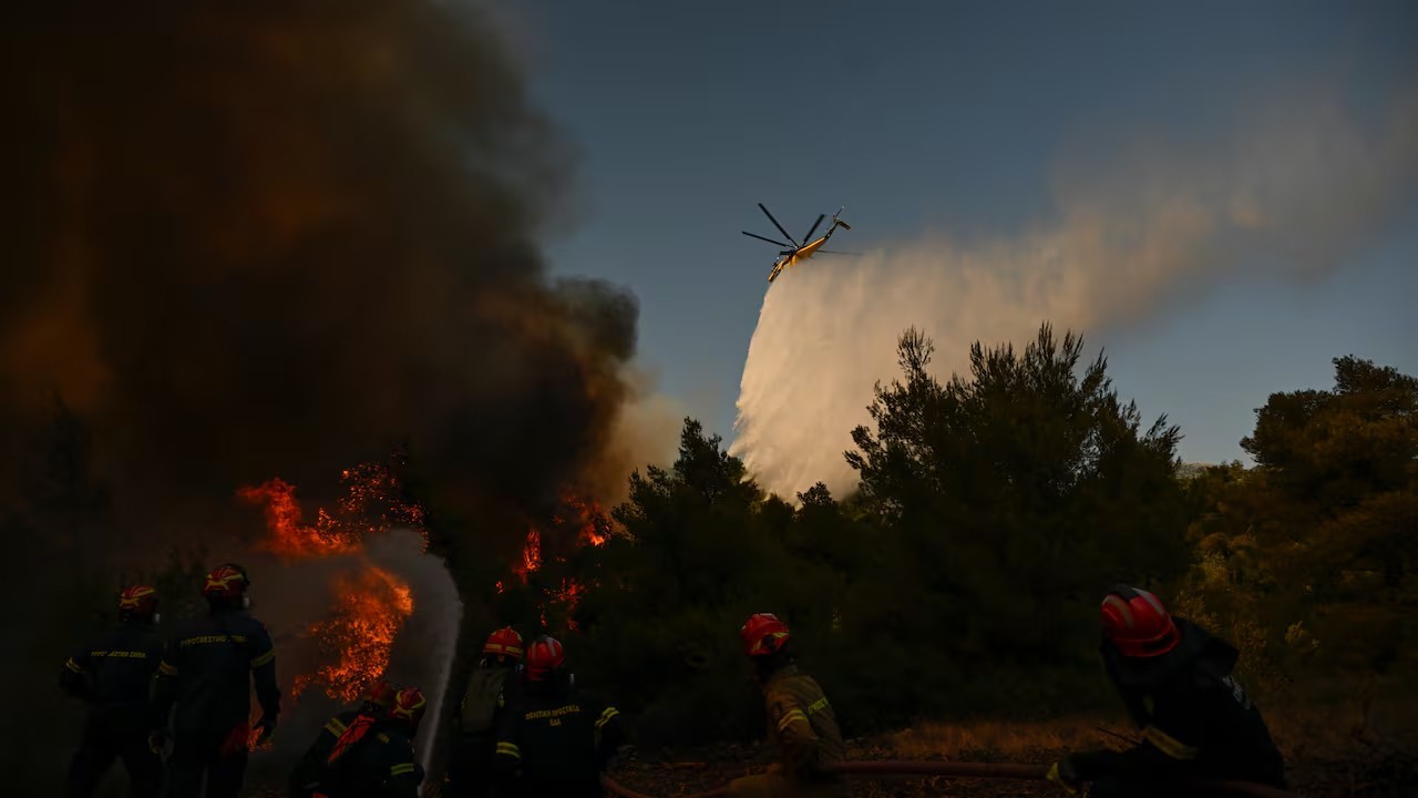 Two die as firefighting helicopters collide in Greece, French blaze changes course